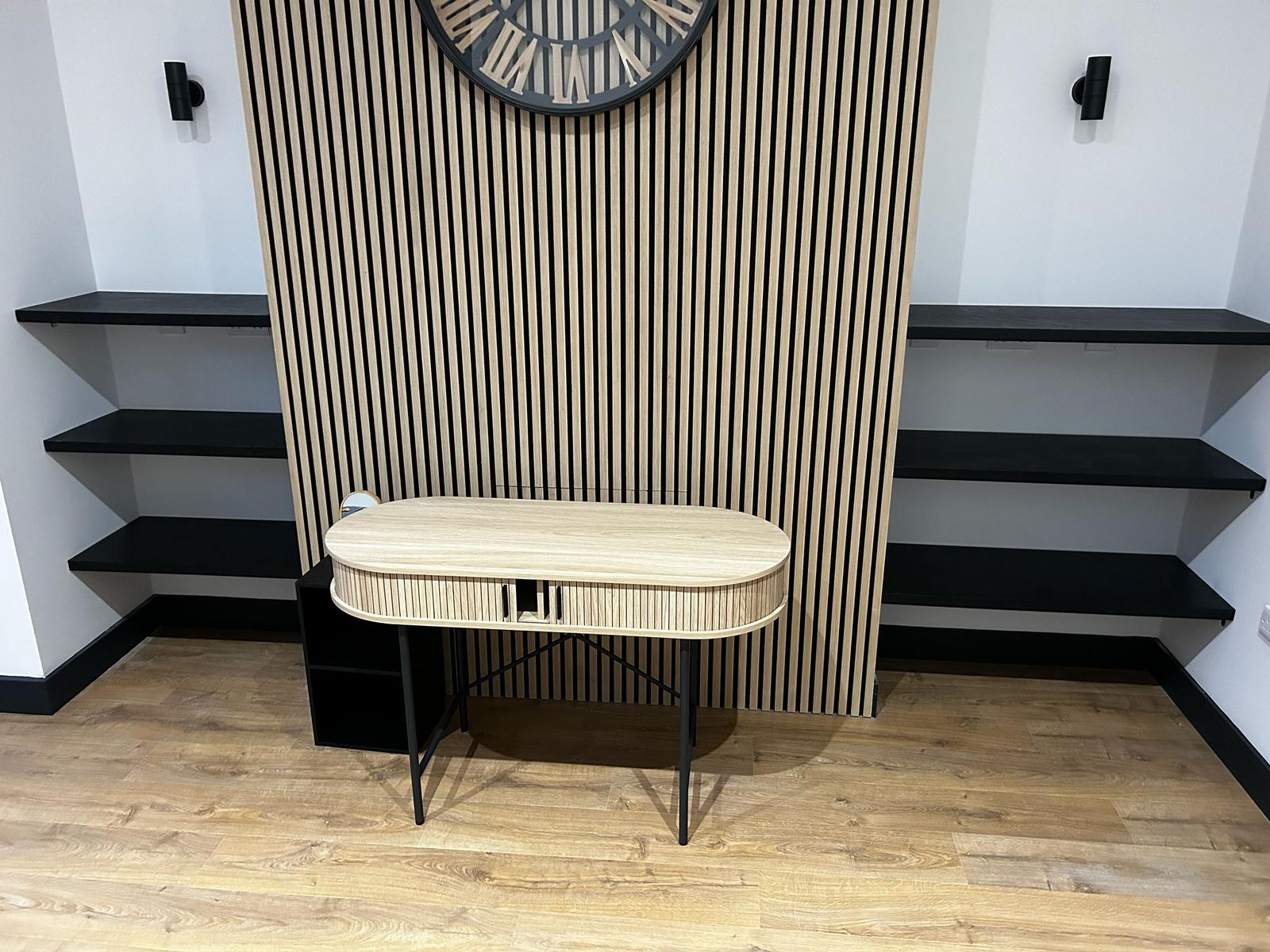 Slatted oak feature wall with floating shelves and console table